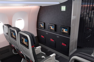 More details of the newly designed Delta main cabin, which features much darker accent walls and seats.