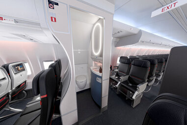 A look at the newly desgined Delta plane bathrooms, which have a cleaner, more open design and darker floors.