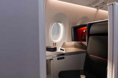A look at the newly desgined Delta first class seats, which feature darker leather seats and clean finishes.