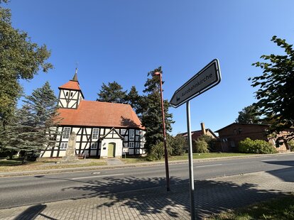 Autobahnkirchen with sign pointing toward it