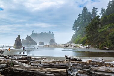 Visitors walk among the driftwood, tide pools and sea stacks at Ruby Beach in the Olympic National Park near Forks, Washington.