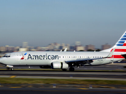 An American Airlines passenger jet (Boeing 737) lands at LaGuardia Airport in New York, New York.
