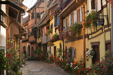 Half-timbered houses on a road in Eguisheim, Alsace, France