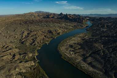 Interstate Highway 40 crosses Colorado River at Needles, California, showing trains, highways, bridges and waterways.