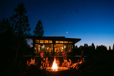 campfire near a cabin at paws up montana