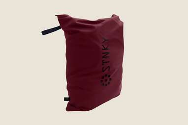 A maroon colored dry bag. 