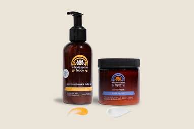 A bottle of lotion and muscle rub in dark brown containers.