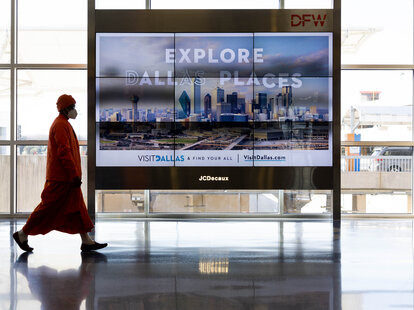 Passengers pass through Dallas-Fort Worth International Airport (DFW) on January 11, 2023 in Dallas, Texas.