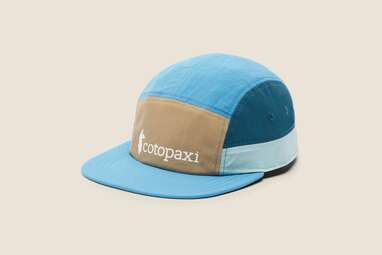 A blue five paneled Cotopaxi hat.
