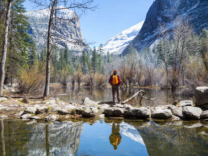 a man looking out into mountains in Yosemite