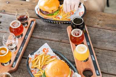 tableau of burgers and beer flights at mountain culture in australia