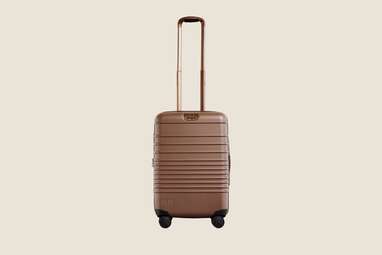 A brown carry-on suitcase.