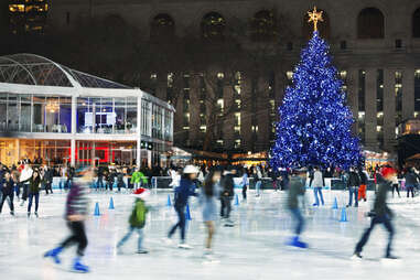 Winter Village at Bryant Park New York, New York with tree and skaters