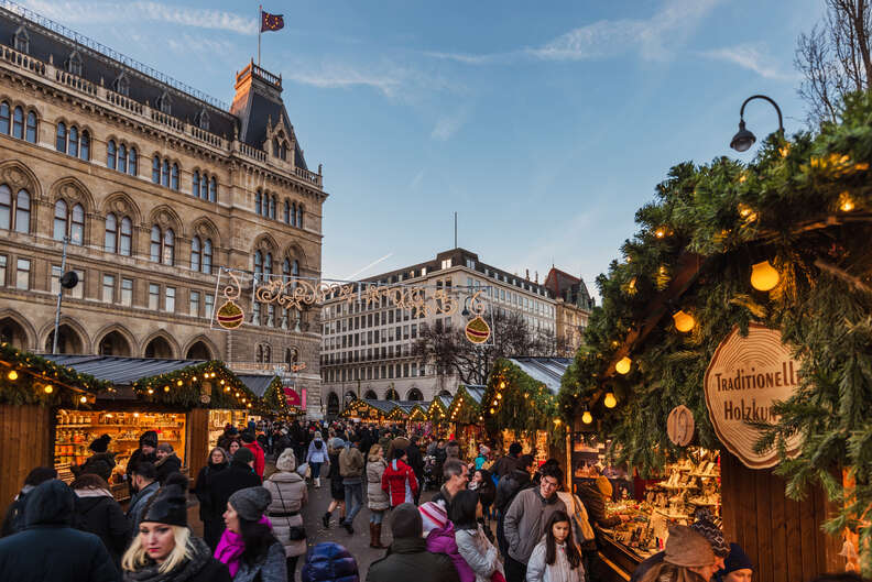 christmas market in Vienna, Austria with buildings and wreaths