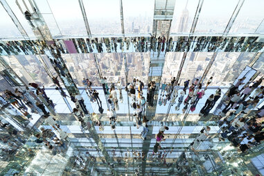 People look out at the city among 30,375 square feet of mirrors at SUMMIT One Vanderbilt in New York on May 22, 2024.