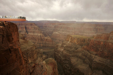 eople take the first official walk on the Skywalk, billed as the first-ever cantilever-shaped glass walkway extending 70 feet from the western Grand Canyon’s rim more than 4,000 feet above the Colorado River, on March 20, 2007 on the Hualapai Reservation.