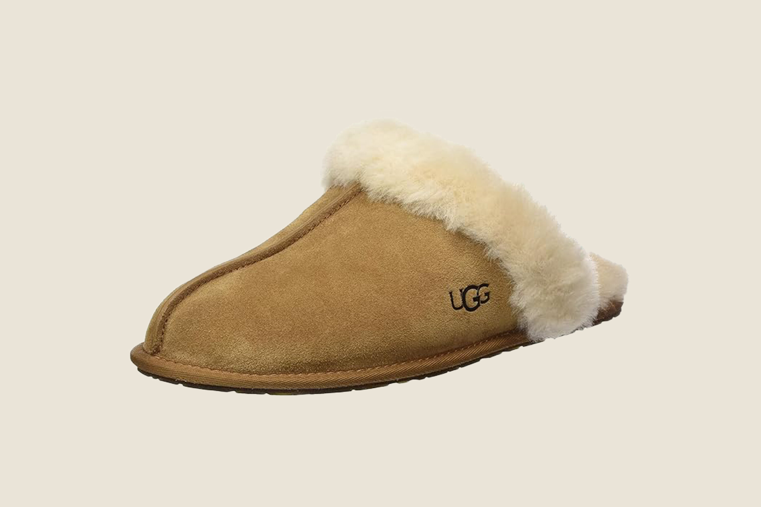 A pair of Ugg scuffette slippers in tan.