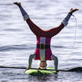 upside down santa on a stand-up paddleboard at dana point, california