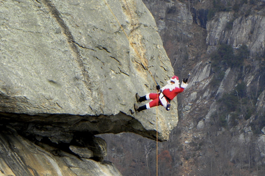 santa claus rappels down chimney rock in north carolina
