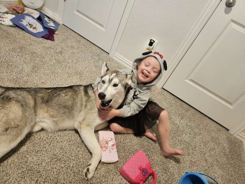 husky with little girl