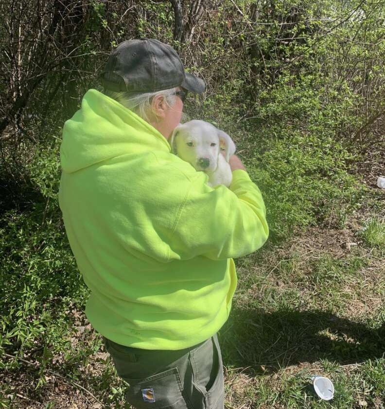 man holding puppy