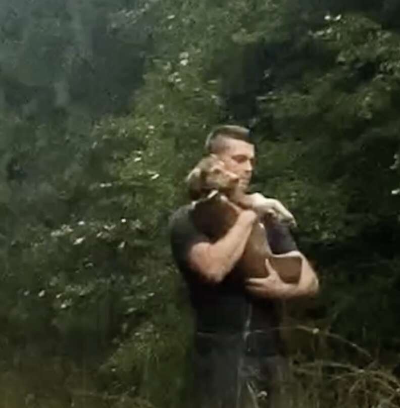 man saving dog