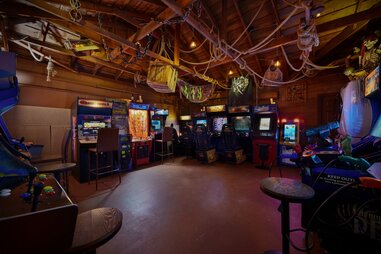arcade machines in a nautical themed room at a rental home in orange county near disneyland