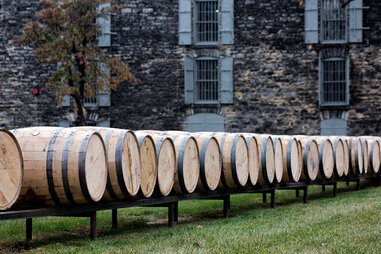 a row of bourbon barrels outdoors at Woodford Reserve outside of Lexington, Kentucky