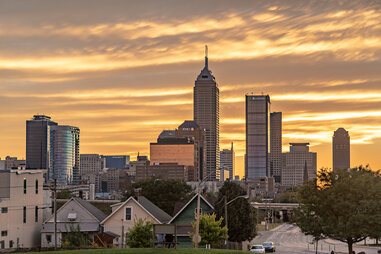 indianapolis skyline at sunset including homes and skyscrapers