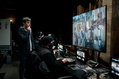 Nathan Fielder looks at a wall of monitors in season one of the hbo show “The Rehearsal”
