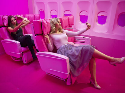 Women snapping selfies at the Supercandy! Pop-Up Museum in Cologne, Germany