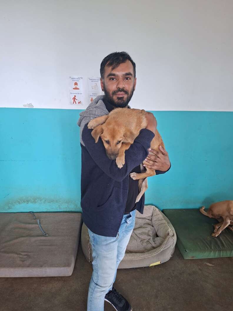 man holding dog