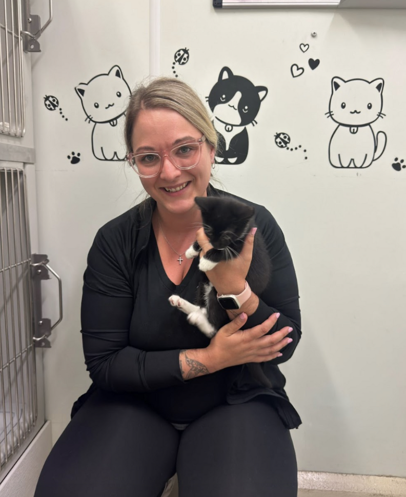 woman holding cat
