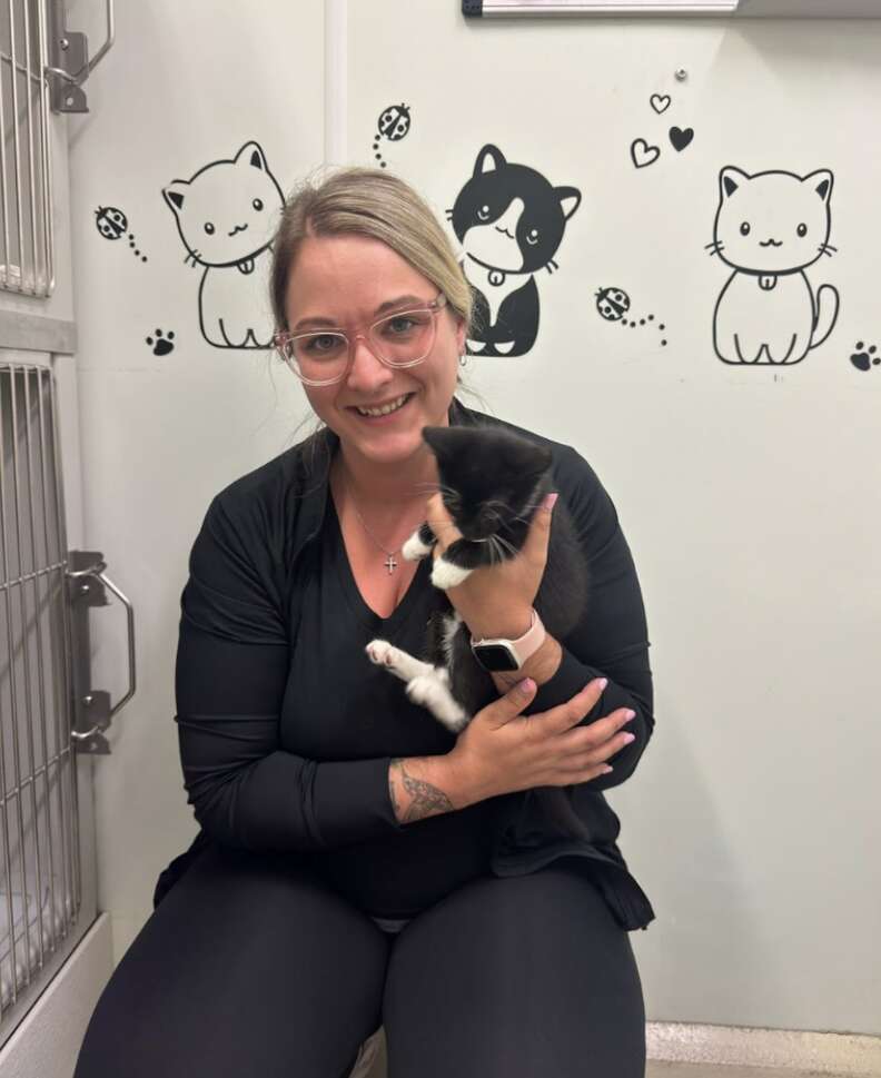 woman holding cat