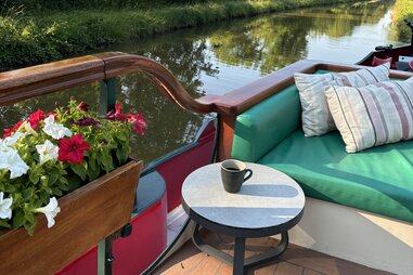 a coffee cup on a microcruising barge in France