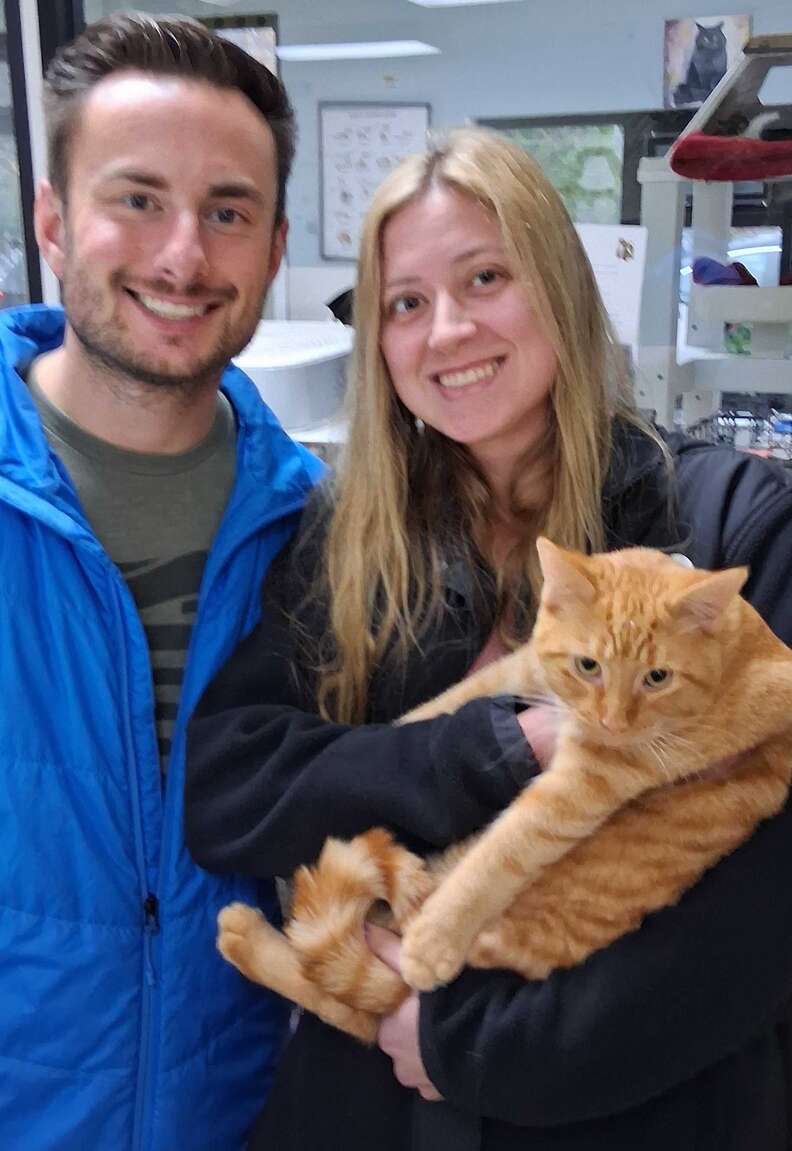 Corn Cob snuggling with new owners at the shelter