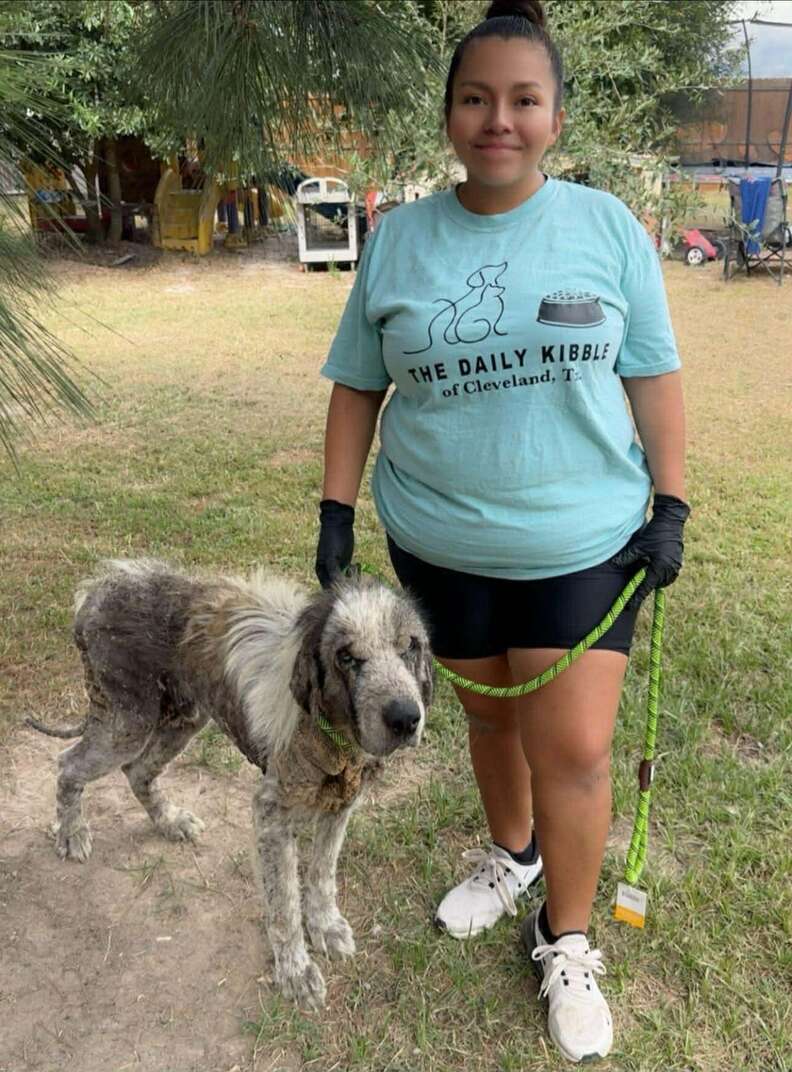 Dog rescuer Zully Ventura poses with one of the rescue pups