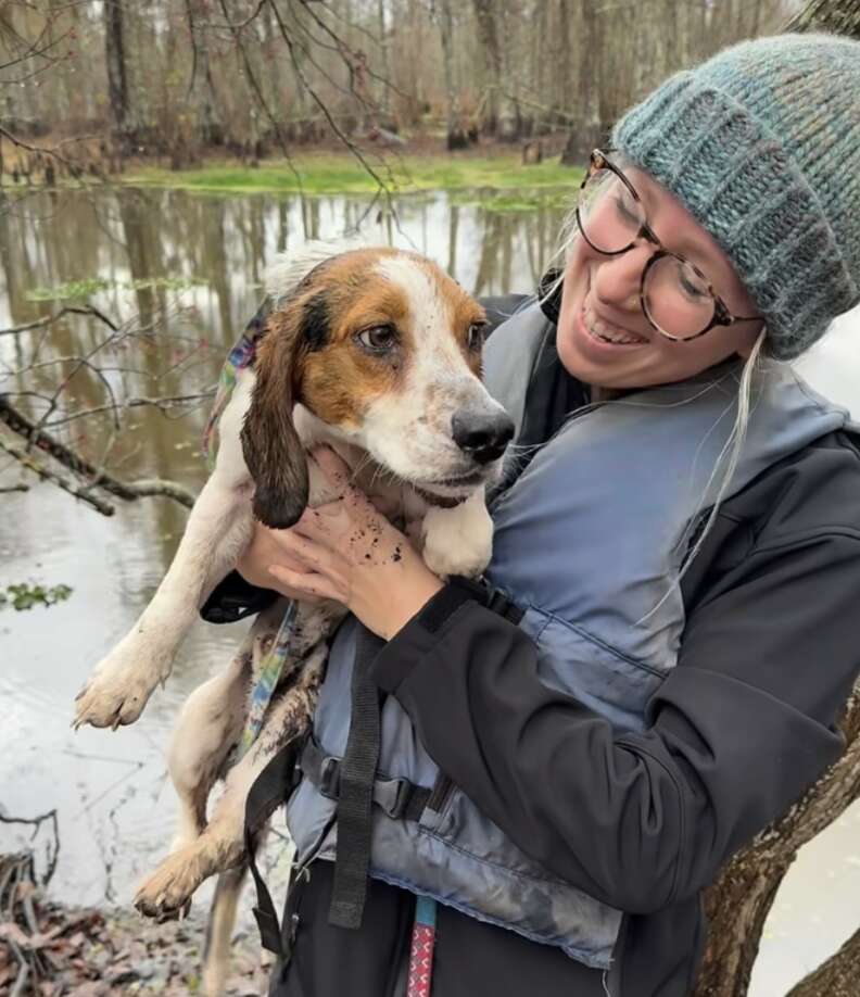 woman holding dog