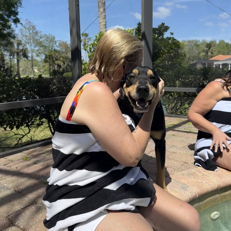 woman hugging dog
