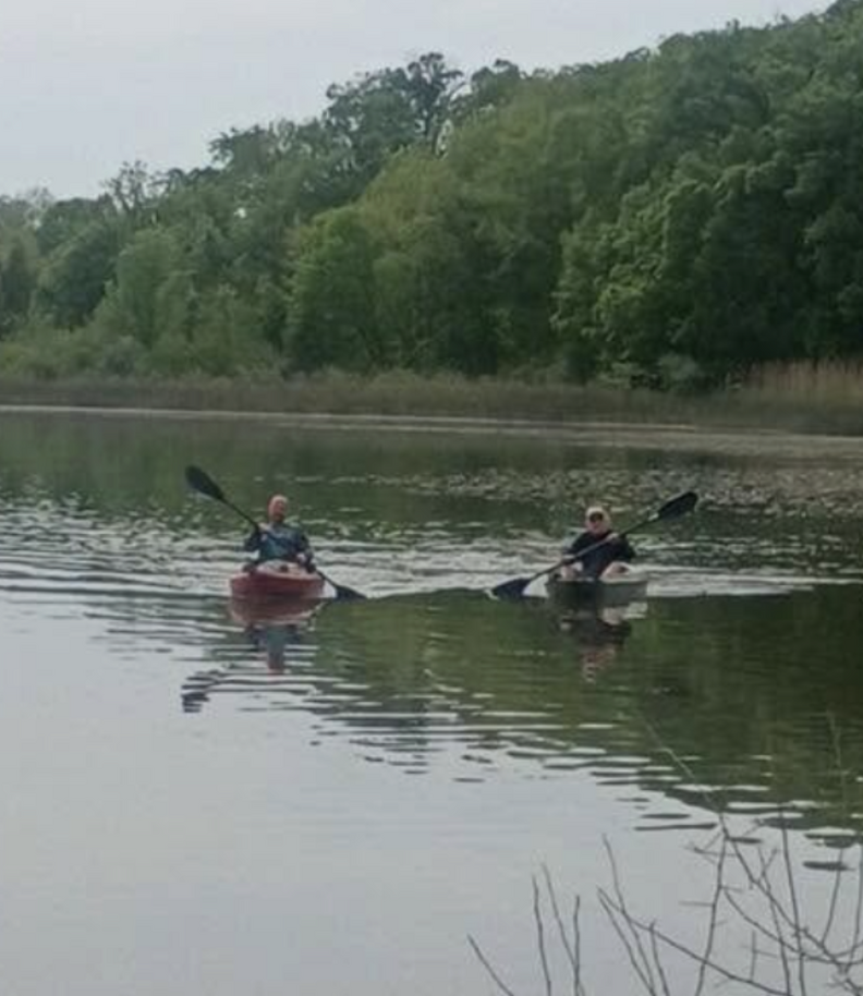 people kayaking on lake 