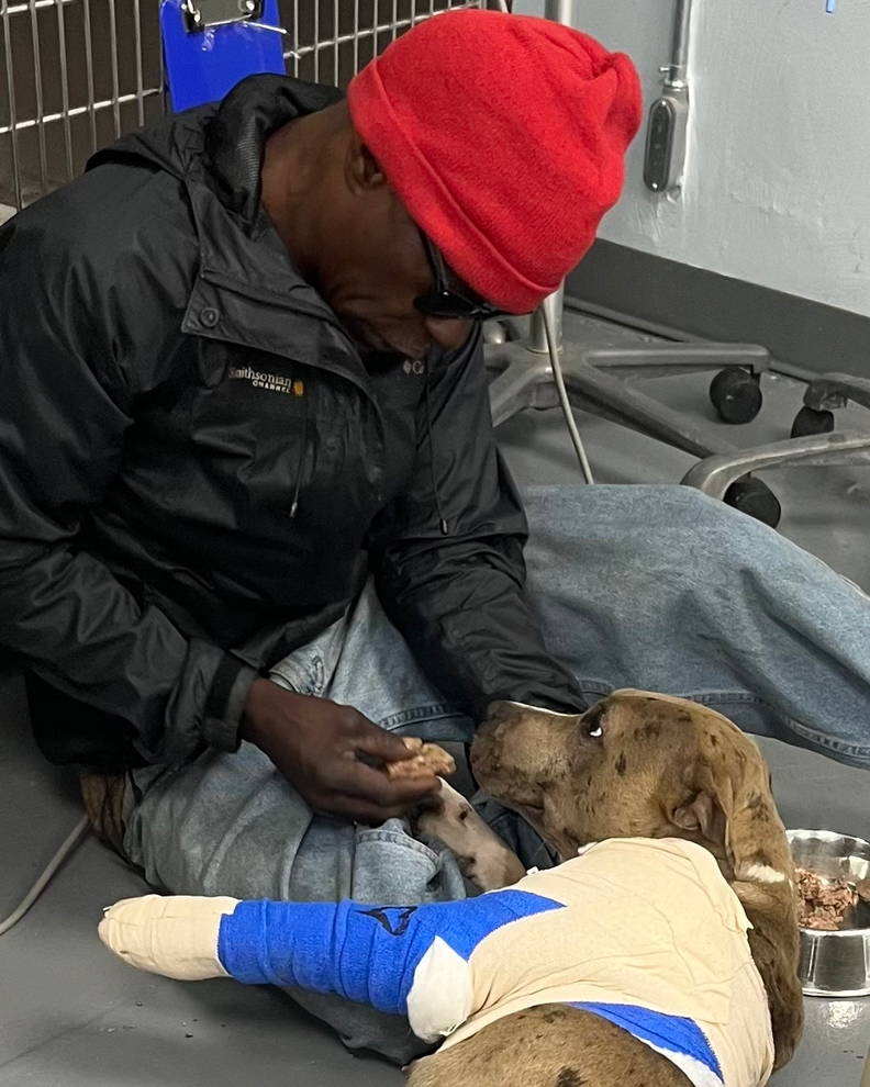 Homeless man visits his dog at the vet