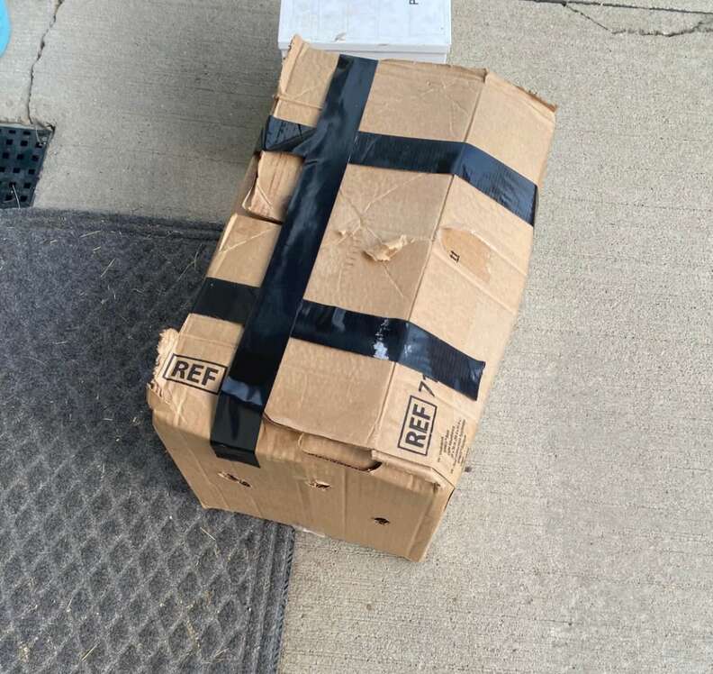 Taped cardboard box outside the clinic