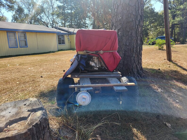 Homeowner finds abandoned trailer in her backyard and realizes it's hiding babies 1 box under tarpaulin on a trailer