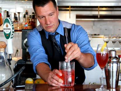 Bartender making cocktails at Monsoon East in Bellevue