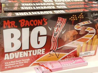 A board game box named "Mr. Bacon's Big Adventure"
