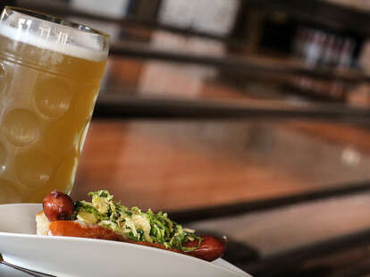 A hot dog and a beer at Bowl and Barrel