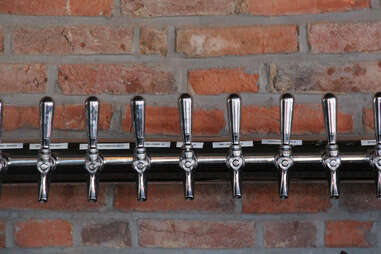Cedar Point Bar & Kitchen's 15 beer taps built into the exposed brick barroom wall