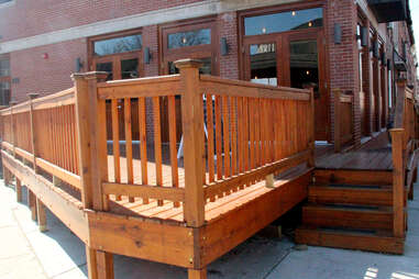The deck at Cedar Point Bar & Kithen, facing the corner of Cedar St