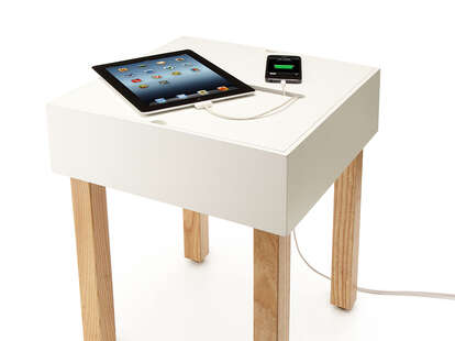 Hub Table charging an iPad and iPhone