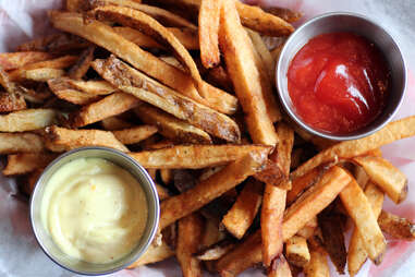 Estelle's fries w/ ketchup & hot sauce